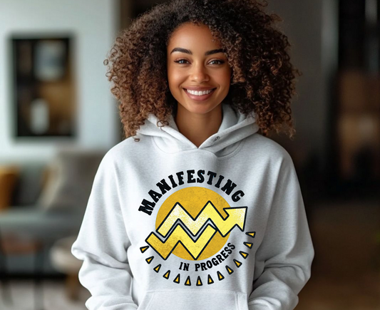 Manifesting In Progress Unisex College Hoodie - Cozy Motivational Sweatshirt for Students and Dreamers